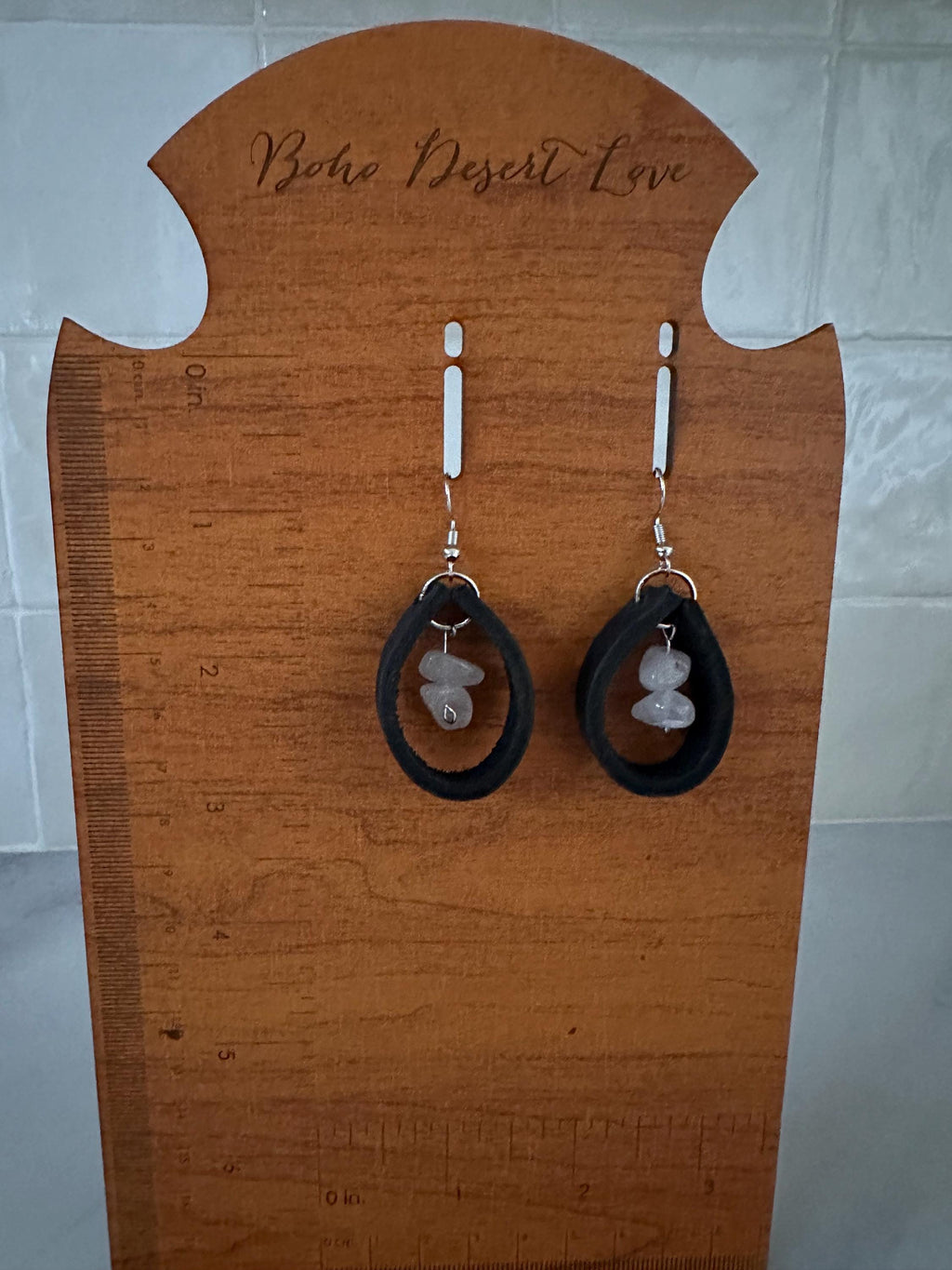 Rose Quartz surrounded in Black Leather with silver plated hooks