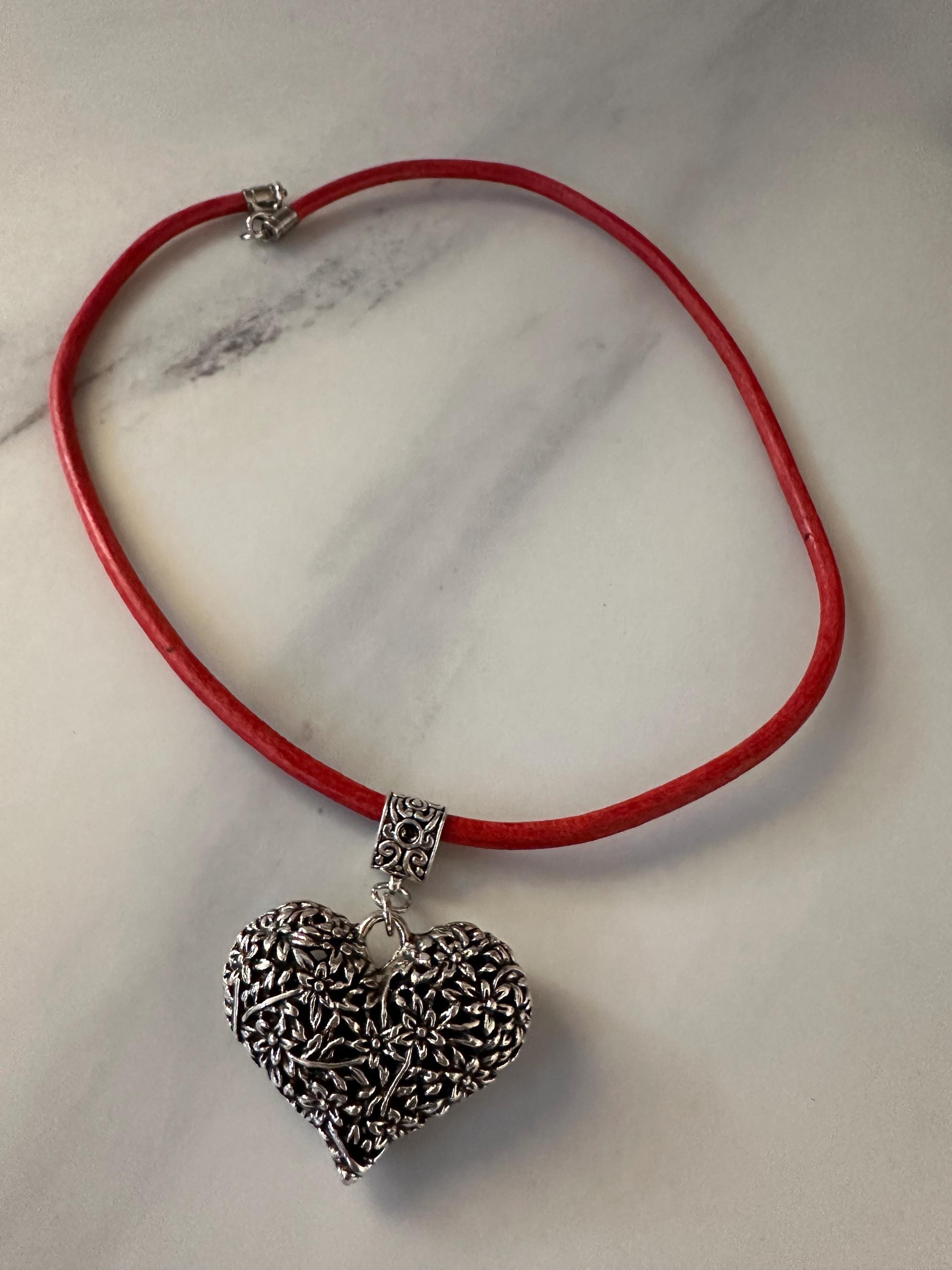 Antique Silver Heart Pendant on red leather cord.