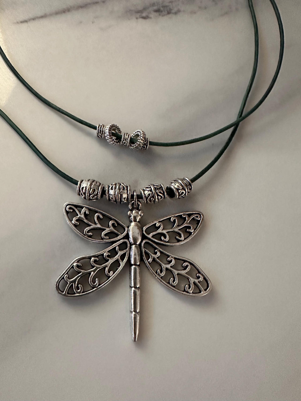 Antique Pewter Dragonfly with silver beads on double layered teal leather cord