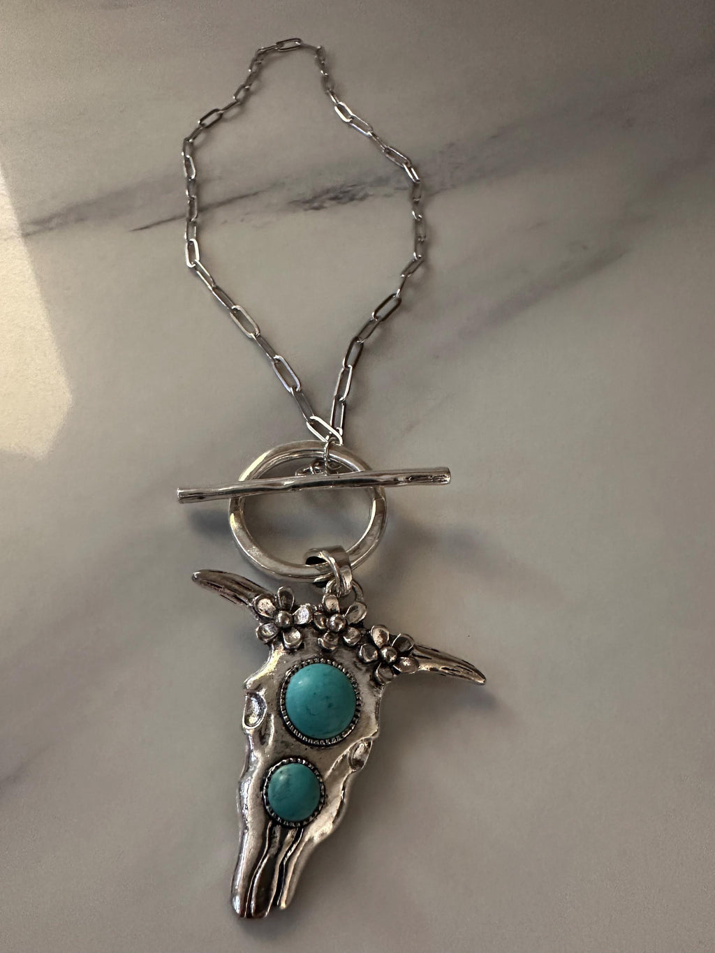 Silver Tone Steer w/Turquoise like stones on Stainless Steel chain with Toggle clasp