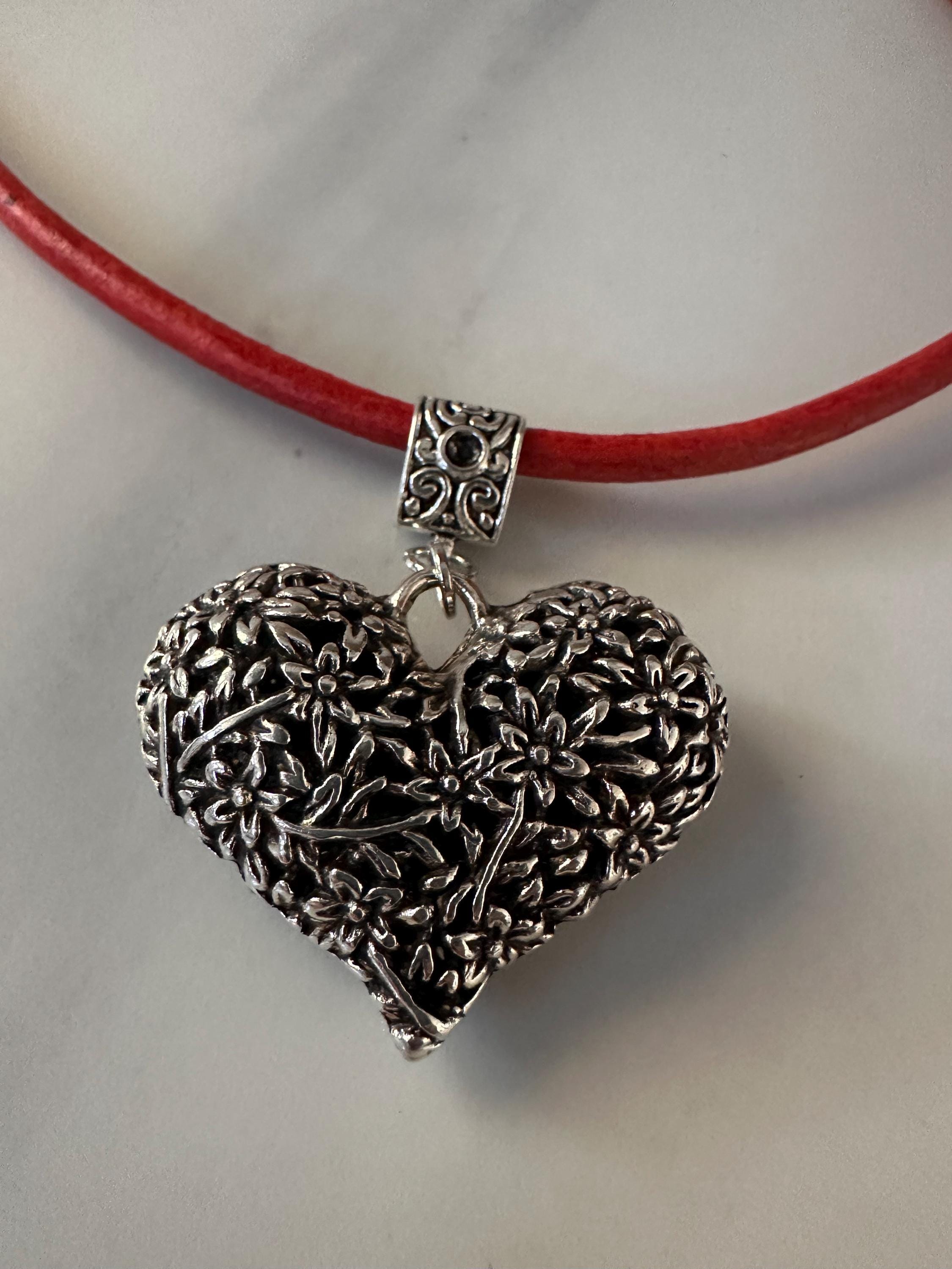 Antique Silver Heart Pendant on red leather cord.