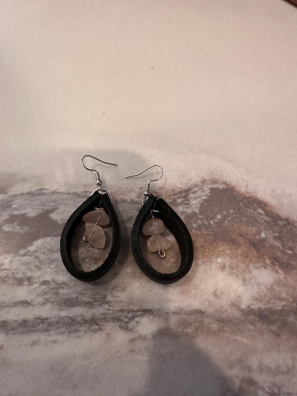 Rose Quartz surrounded in Black Leather with silver plated hooks