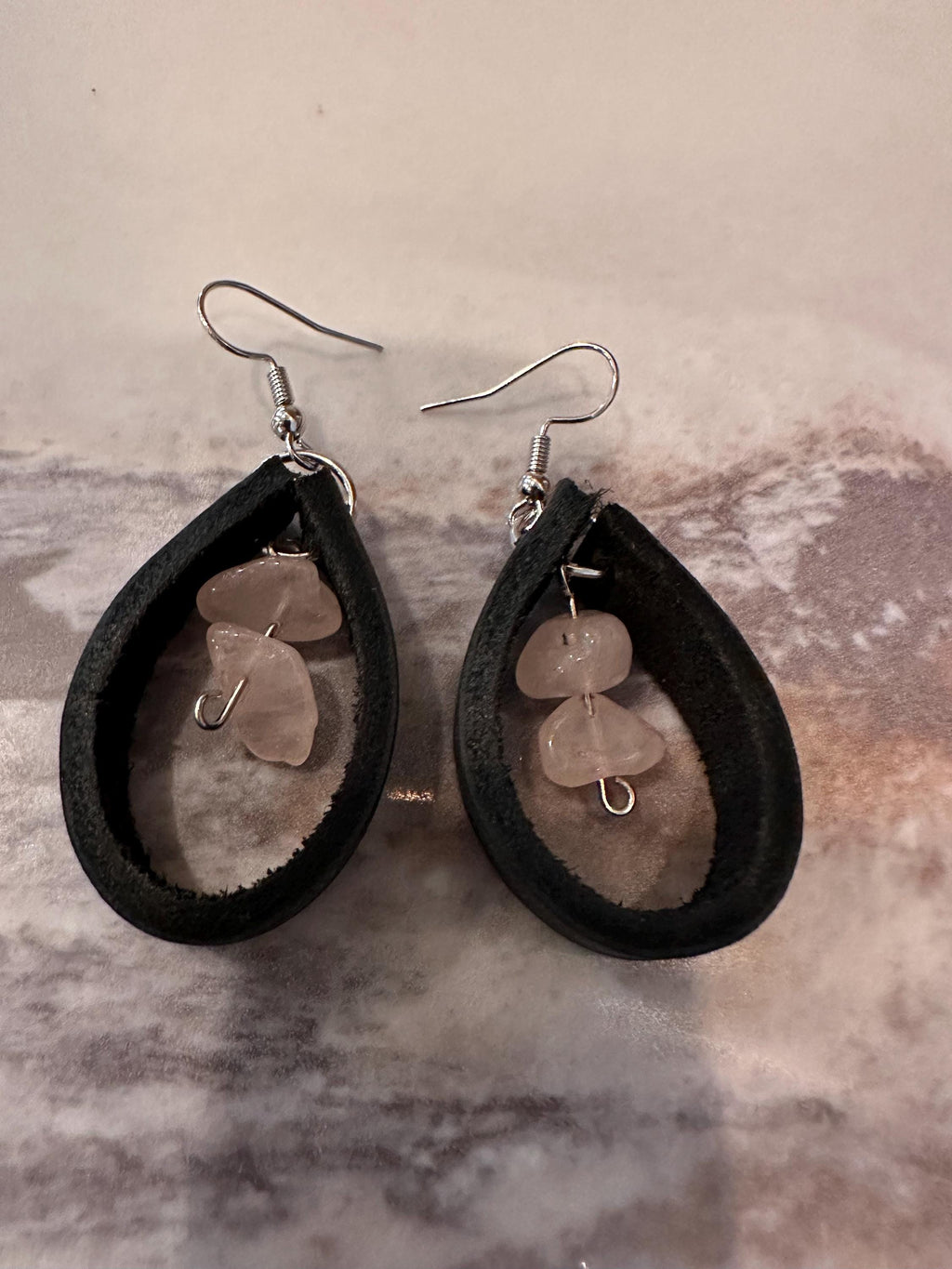 Rose Quartz surrounded in Black Leather with silver plated hooks